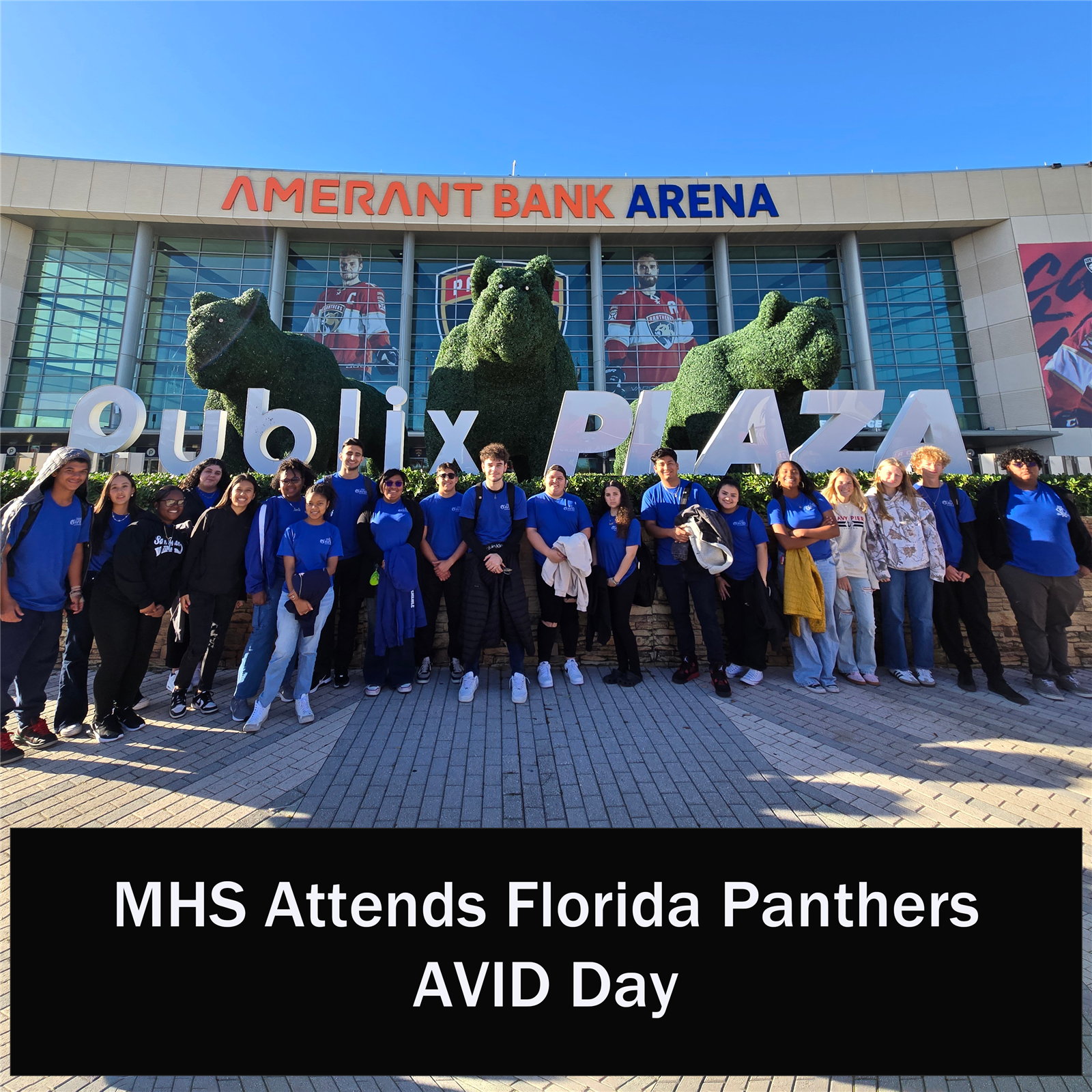  group posing in front of Panter's Stadium